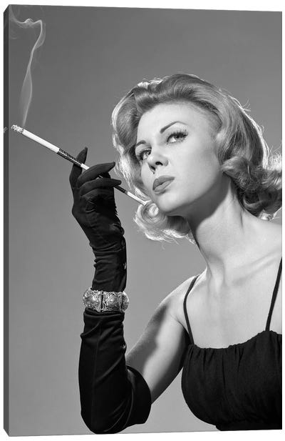 1960s Sexy Sultry Woman In Black Evening Dress Long Black Gloves Bracelet Smoking Cigarette In Long Cigarette Holder Canvas Art Print - Vintage Images