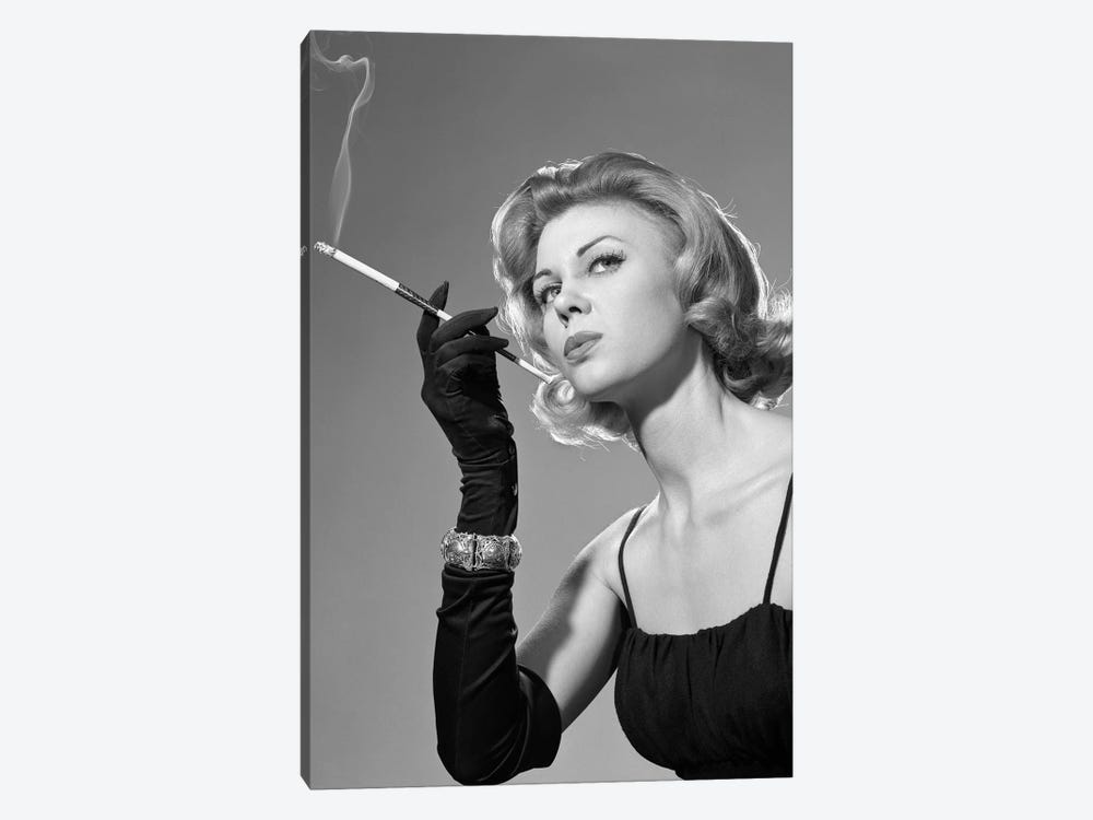 1960s Sexy Sultry Woman In Black Evening Dress Long Black Gloves Bracelet Smoking Cigarette In Long Cigarette Holder by Vintage Images 1-piece Canvas Print