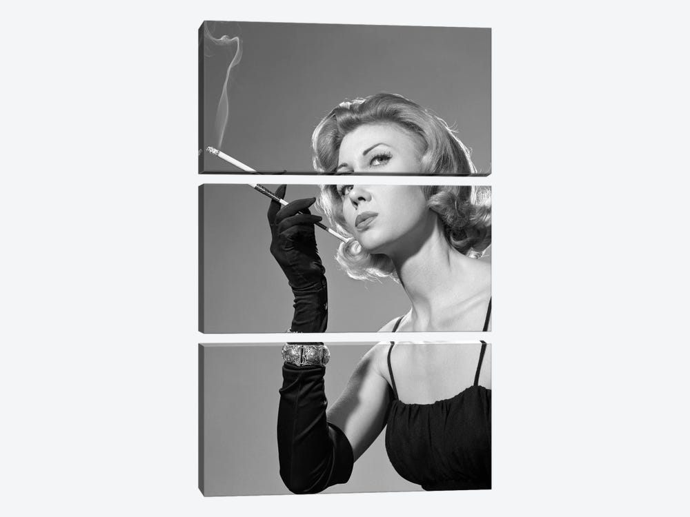 1960s Sexy Sultry Woman In Black Evening Dress Long Black Gloves Bracelet Smoking Cigarette In Long Cigarette Holder by Vintage Images 3-piece Canvas Art Print