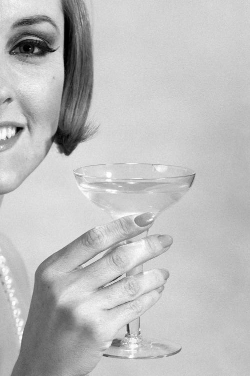1960s Smiling Woman Wearing Pearls Offering A Toast Looking At Camera