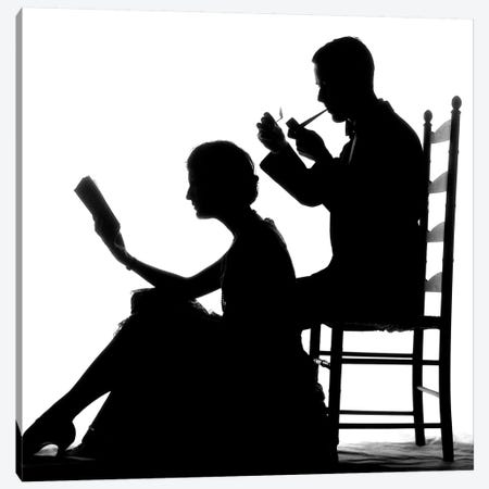 1920s 1930s Anonymous Silhouetted Man In Ladder-Back Chair Smoking Pipe With Woman Seated On Floor In Front Of Him Reading Book Canvas Print #VTG673} by Vintage Images Canvas Print