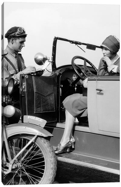 1920s Woman In Car Getting Ticketed By Motorcycle Cop Canvas Art Print - Vintage Images