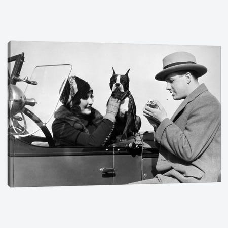 1920s Woman Sitting In Driver's Seat Convertible Car With Boxer Dog Man Lighting Cigarette Canvas Print #VTG678} by Vintage Images Canvas Art Print