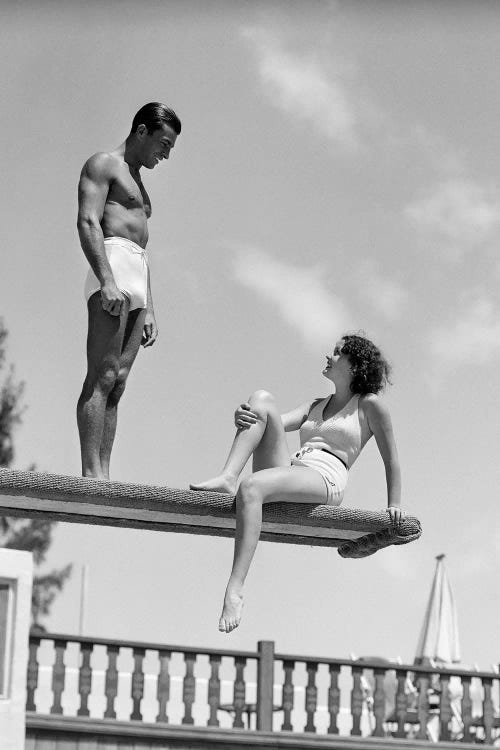 1930s Couple On Swimming Pool Diving Board Talking