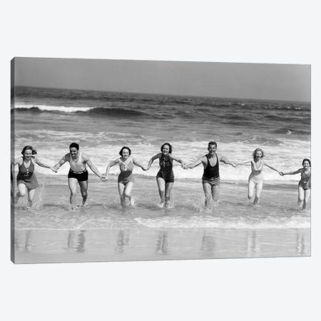 1930s Group 7 People Holding Hands Running Out Of Surf Onto Beach Canvas Print #VTG683} by Vintage Images Canvas Artwork