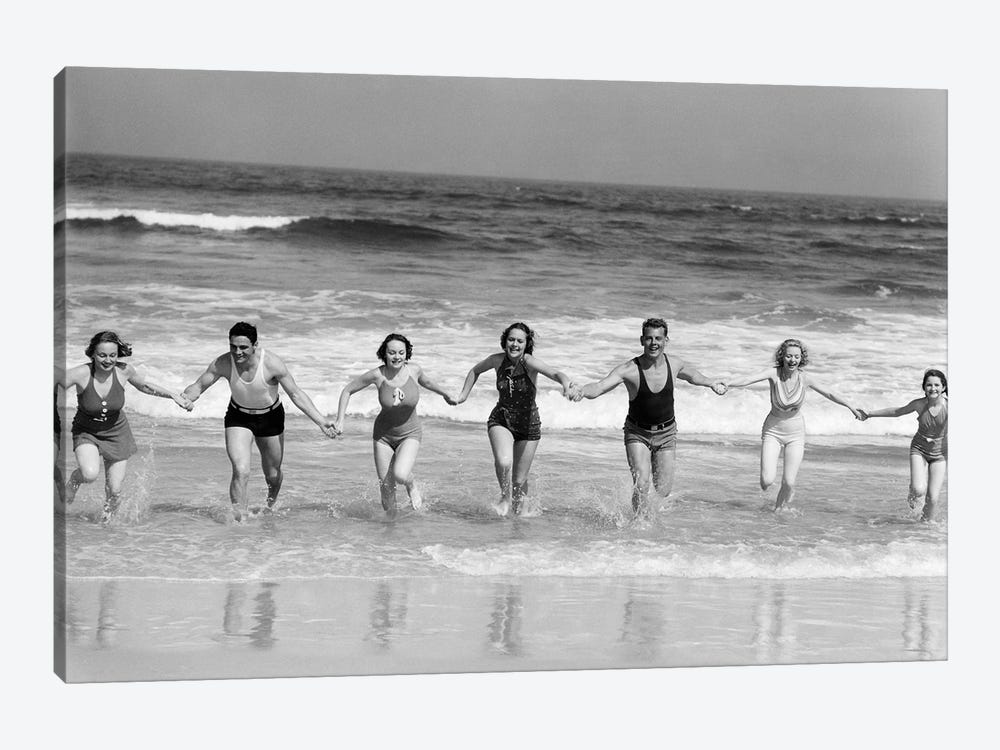 1930s Group 7 People Holding Hands Running Out Of Surf Onto Beach by Vintage Images 1-piece Canvas Art Print