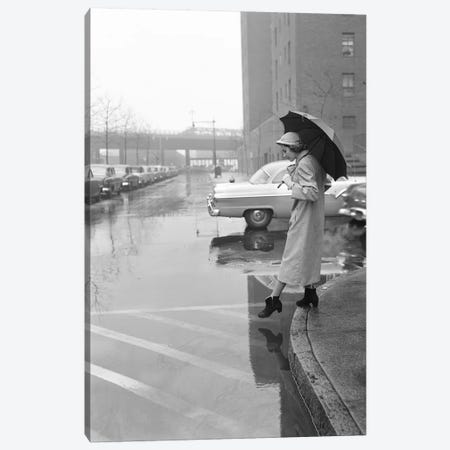 1950s Woman In Rain Coat Hat Boots Holding Umbrella Crossing City Street In Wet Foul Weather Canvas Print #VTG690} by Vintage Images Canvas Art Print