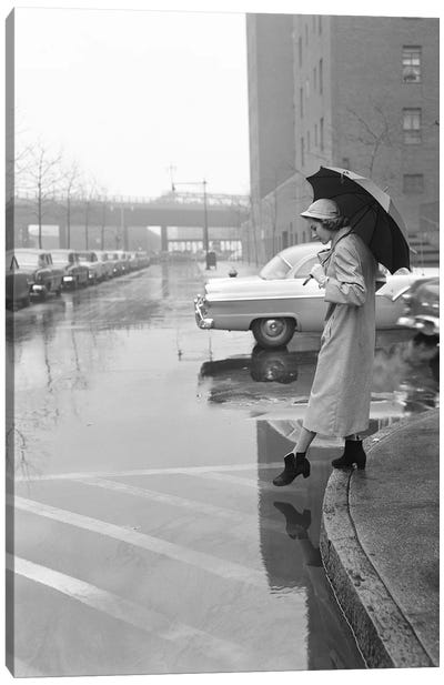 1950s Woman In Rain Coat Hat Boots Holding Umbrella Crossing City Street In Wet Foul Weather Canvas Art Print - Boots