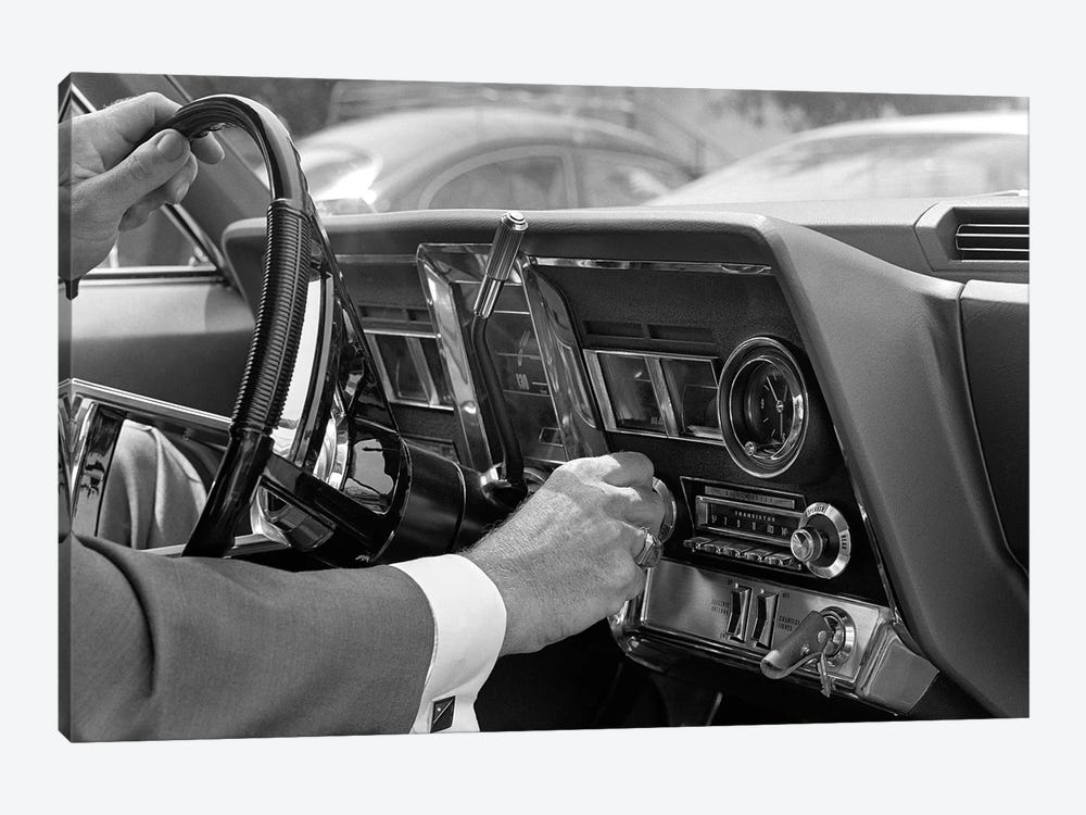 1960s Hand On Car Radio Dials And Steering Wheel by Vintage Images 1-piece Canvas Print