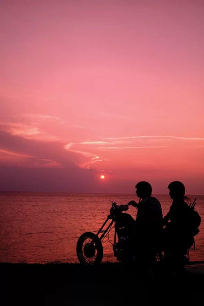 Motorcycles: 1970s Anonymous Silhouetted Couple Riding Chopper Motorcycle Against Ocean Sunset by Vintage Images