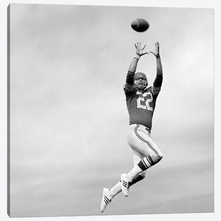 1970s Player Jumping To Catch Football Pass Canvas Print #VTG698} by Vintage Images Art Print
