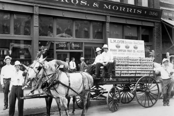 1890s Mule Drawn Fruit Delivery Wagon On City Street Surrounded By Men Looking At Camera