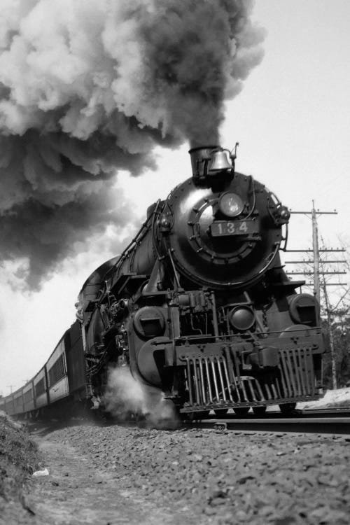 1920s-1930s Steam Engine Pulling Passenger Train Smoke Billowing From Exhaust Stack