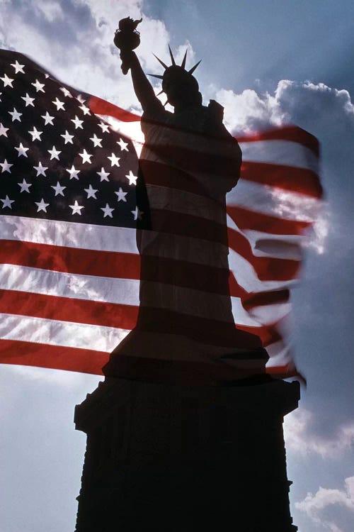 Statue Of Liberty New York Silhouetted Against American Flag And Clouds