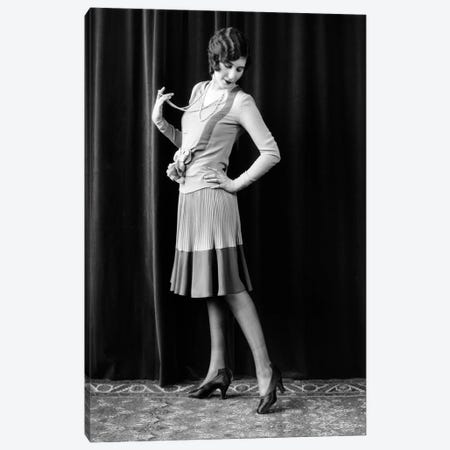 1920s Flapper Woman Posing Hand On Hip Holding String Of Pearls Stretching Leg Checking Hosiery Seams Canvas Print #VTG746} by Vintage Images Canvas Artwork