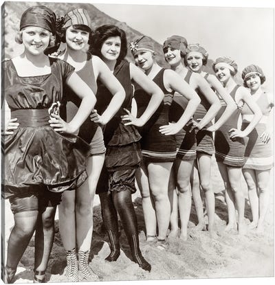 1920s Group Of Smiling Women Wearing One Piece Bathing Suits And Caps Posing Lined Up On Beach Looking At Camera Canvas Art Print - Vintage Images