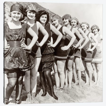 1920s Group Of Smiling Women Wearing One Piece Bathing Suits And Caps Posing Lined Up On Beach Looking At Camera Canvas Print #VTG747} by Vintage Images Canvas Artwork