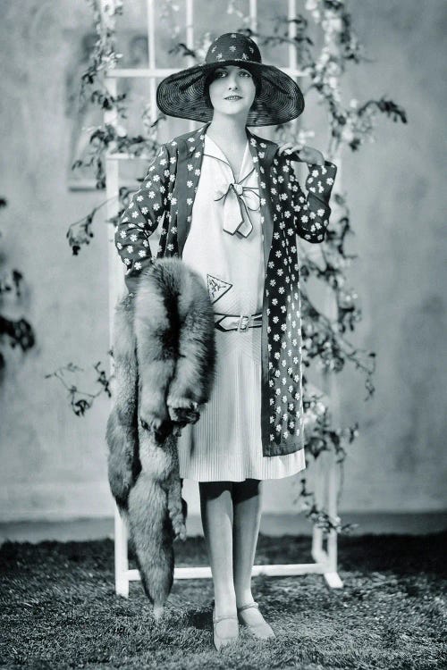 1920s Woman Looking At Camera Wearing Polka Dot Coat Over Dress With Very Fashionable Red Fox Fur Stole And Big Hat