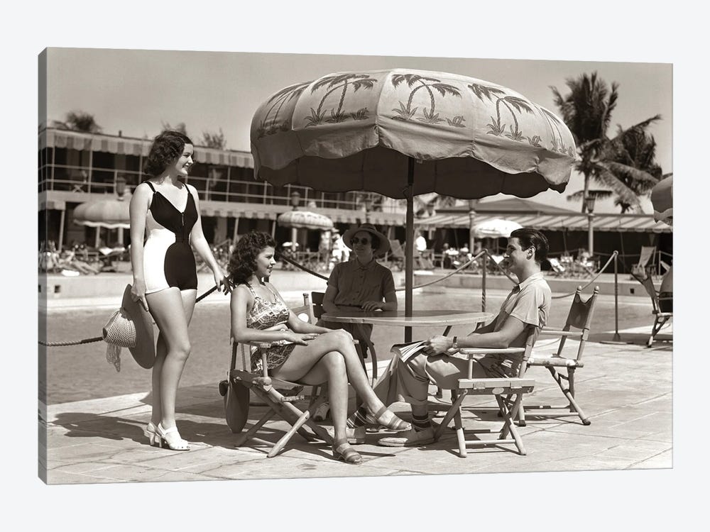 1930s 1940s 3 Women Bathing Suits Single Man Casual Clothes Sitting Talking Under Pool Side Umbrella Miami Beach Florida USA by Vintage Images 1-piece Canvas Art Print