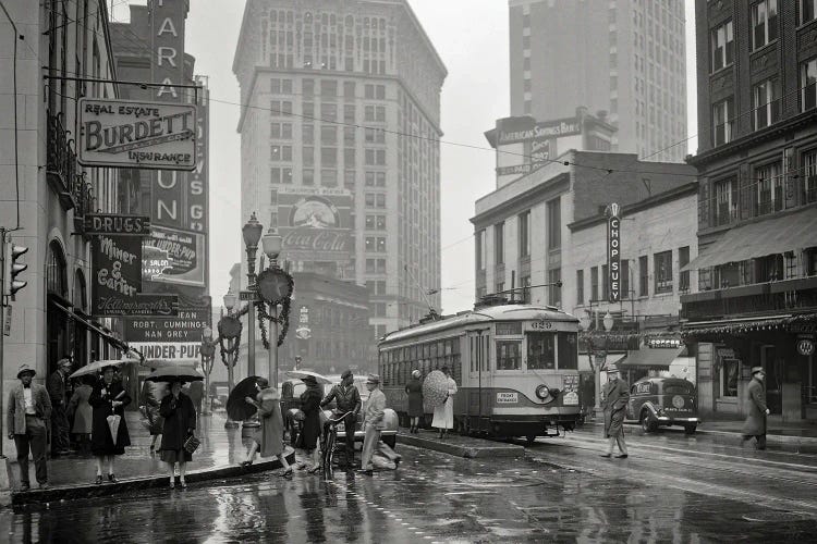 1930s 1940s Peachtree Street Shops Signs Cars Public Trolley And Pedestrians Shoppers Walking In The Rain Atlanta Georgia USA