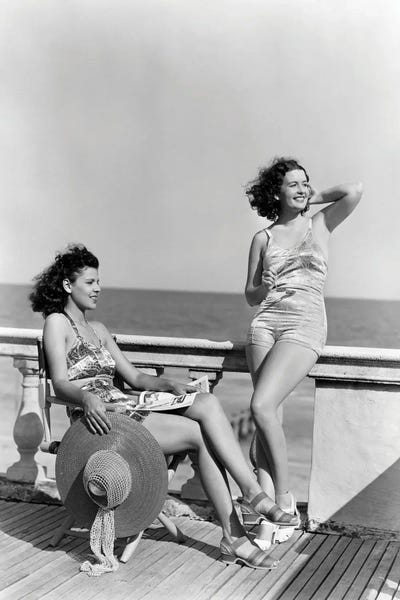 1930s 1940s Two Women Sitting On Hotel Deck Beach Side In One Piece Bathing Suit Fashion Florida USA