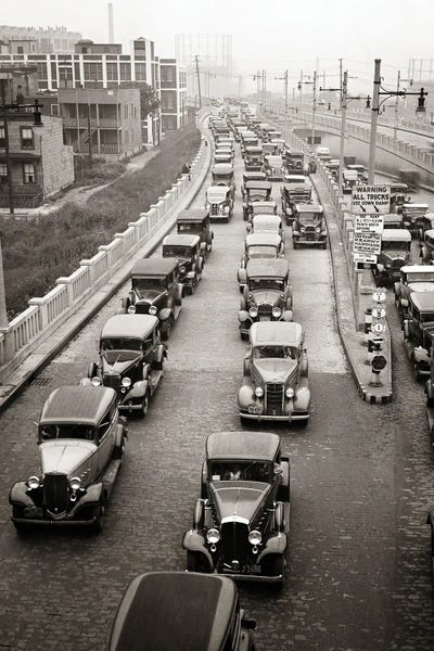 New Jersey: 1930s Afternoon Rush Hour Traffic Jammed Cars Leaving Pulaski Skyway Heading For The Holland Tunnel Jersey City New Jersey USA by Vintage Images