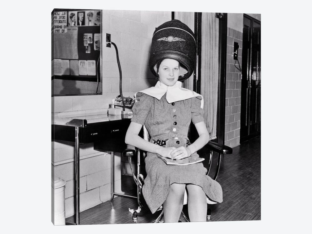 1930s Smiling Woman Looking At Camera Sitting Under Electric Hair Dryer In Professional Beautician Training School by Vintage Images 1-piece Art Print