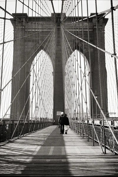 Brooklyn Bridge: 1940s Back View Of Couple Man Usn Sailor In Uniform With His Arm Around Woman Walking On The Brooklyn Bridge New York City USA by Vintage Images