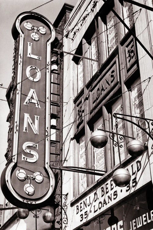 1940s Pawnbrokers Shop With Neon Sign For Loans And Symbol Of Three Gold Spheres Suspended From A Bar