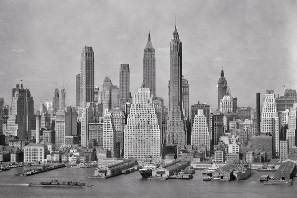 Brooklyn: 1940s Skyline Of Downtown Financial District NYC Spires Of Woolworth Building Irving Trust And 40 Wall Street From Brooklyn by Vintage Images