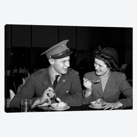 1940s Smiling Couple Man Soldier In Army Uniform And Woman Girlfriend Sitting At Soda Fountain Counter Eating Dish Of Ice Cream Canvas Print #VTG779} by Vintage Images Canvas Artwork