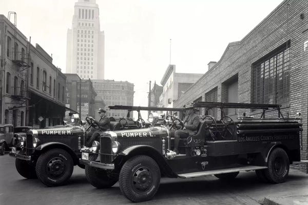 Los Angeles: 1920s-1930s Two Fire Trucks With Los Angeles City Hall California USA In Background by Vintage Images