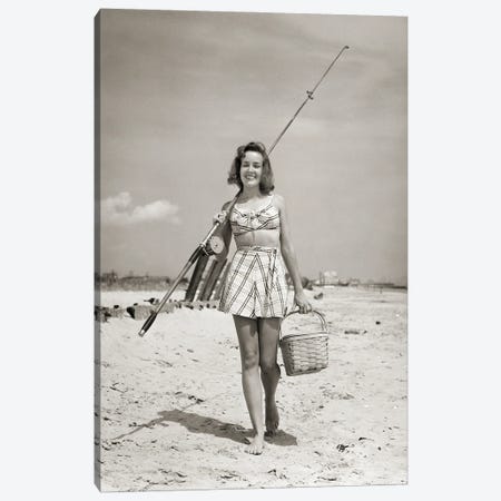 1940s Smiling Young Woman Walking On Beach Looking At Camera Wearing Two Piece Bathing Suit Skirt Carrying Surf Fishing Gear Canvas Print #VTG780} by Vintage Images Canvas Art Print