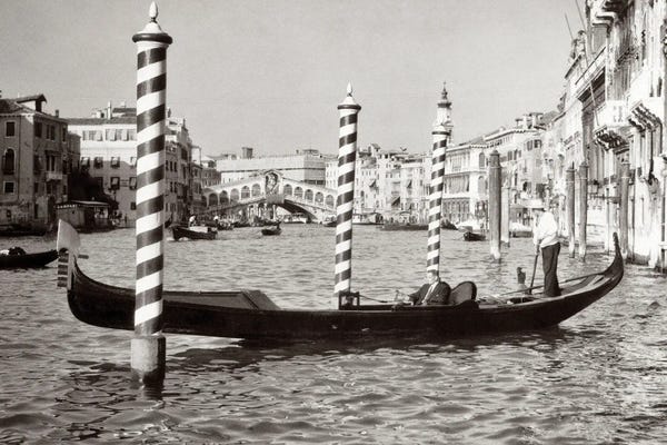 1950s Anonymous Businessman Riding In Gondola Rowing Boat On The Grand Canal The Rialto Bridge In Background Venice Italy
