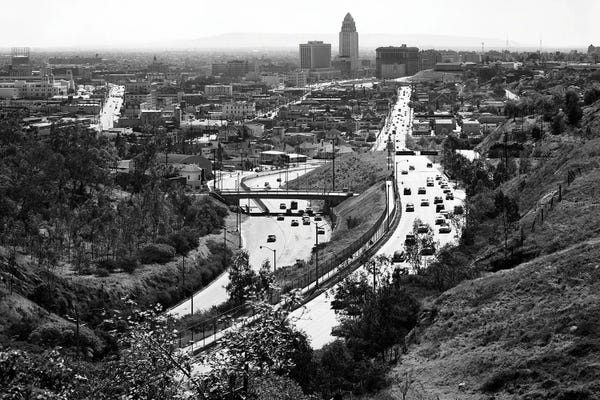 Los Angeles: 1950s City Hall In Center Of Skyline With Highway Freeway Traffic Into And From Los Angeles California USA by Vintage Images