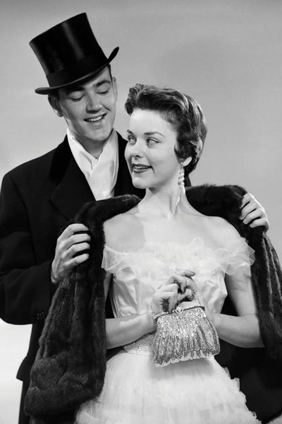 Women's Coats & Jackets: 1950s Couple Formal Attire Man Wearing Top Hat Helping Woman In Evening Clothes With Fur Stole by Vintage Images