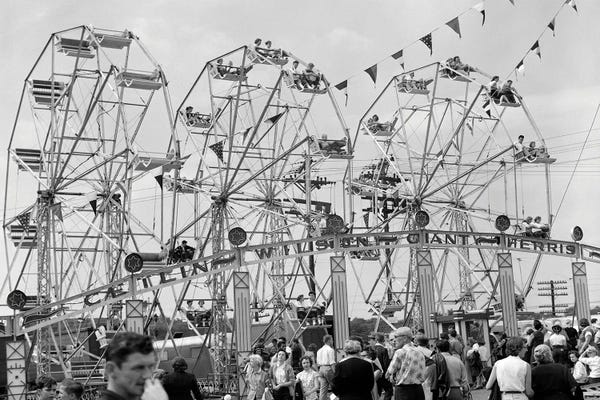 1950s Fair Scene Showing 3 Giant Ferris Wheels & Crowd Below