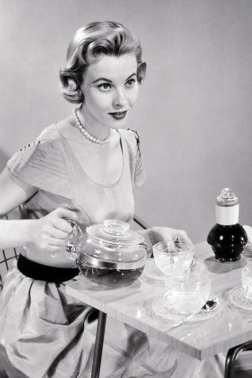 1950s Hostess Woman Housewife Serving Pouring Tea Coffee Seated At Table