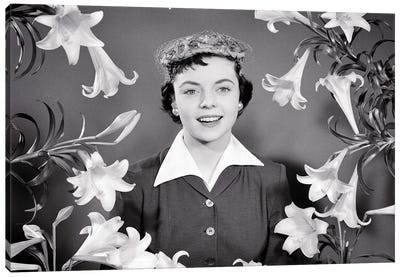 1950s Portrait Smiling Brunette Woman Wearing Easter Bonnet Hat Looking At Camera Surrounded Framed By Easter Lilies Canvas Art Print - Lily Art