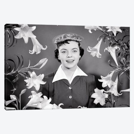 1950s Portrait Smiling Brunette Woman Wearing Easter Bonnet Hat Looking At Camera Surrounded Framed By Easter Lilies Canvas Print #VTG797} by Vintage Images Art Print