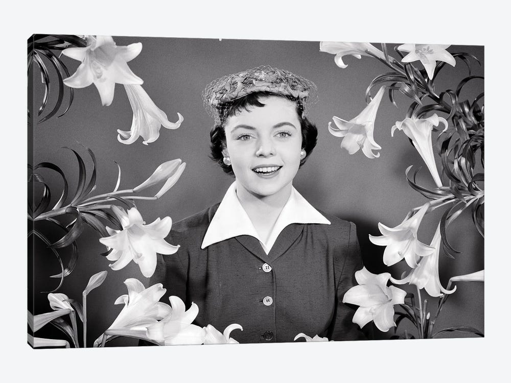1950s Portrait Smiling Brunette Woman Wearing Easter Bonnet Hat Looking At Camera Surrounded Framed By Easter Lilies by Vintage Images 1-piece Canvas Art Print