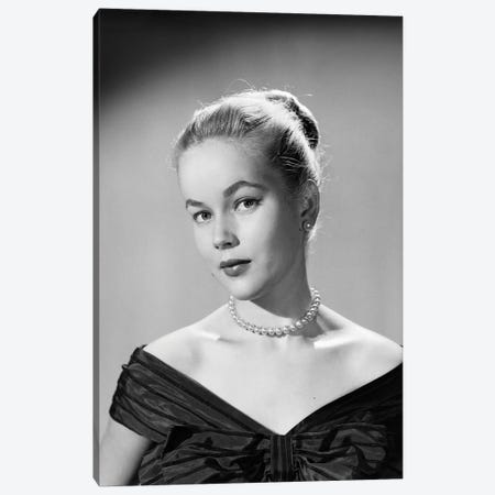 1950s Portrait Young Blond Woman Serious Facial Expression Pearl Necklace Black Satin V Neckline Evening Dress Looking At Camera Canvas Print #VTG798} by Vintage Images Canvas Artwork