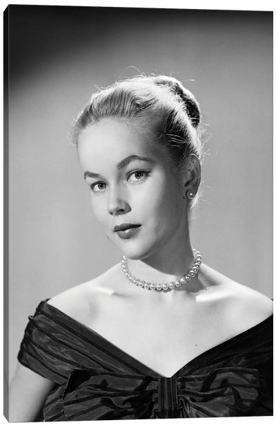 1950s Portrait Young Blond Woman Serious Facial Expression Pearl Necklace Black Satin V Neckline Evening Dress Looking At Camera Canvas Art Print - Vintage Images