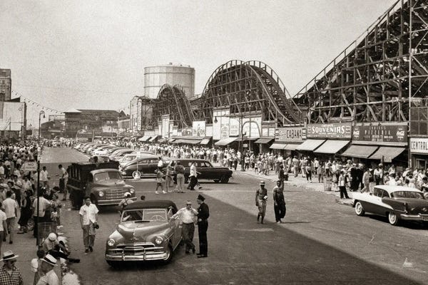 Amusement Parks: 1950s Roller Coaster Crowded Streets Parked Cars Coney Island Brooklyn New York USA by Vintage Images