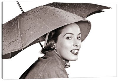 1950s Smiling Woman Looking At Camera Under An Umbrella Wearing Raincoat And Hat Canvas Art Print - Vintage Images