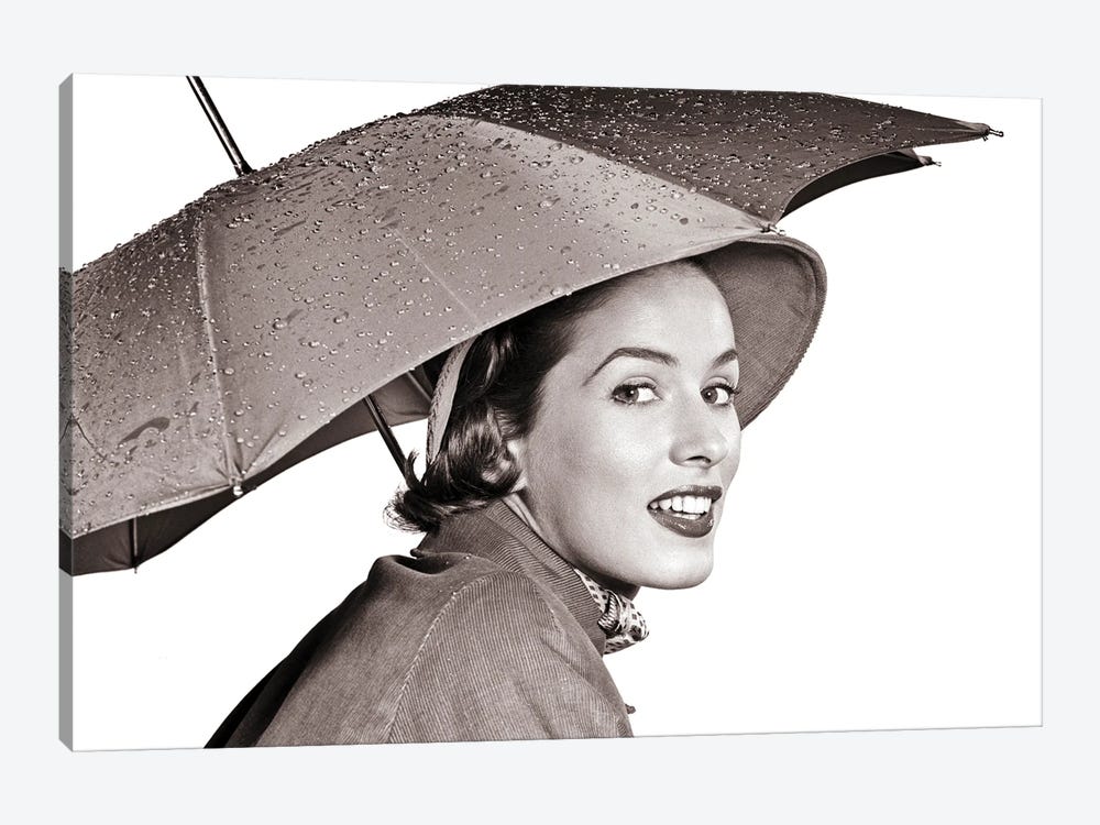 1950s Smiling Woman Looking At Camera Under An Umbrella Wearing Raincoat And Hat by Vintage Images 1-piece Canvas Wall Art