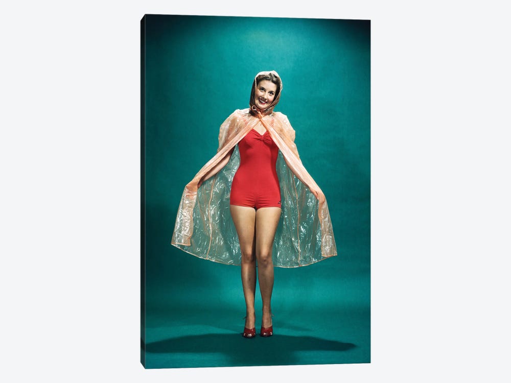 1950s Smiling Woman Pinup Wearing Red One Piece Bathing Suit Rain Cape Looking At Camera by Vintage Images 1-piece Art Print