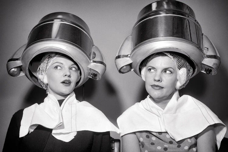 1950s Two Women Sitting Under Beauty Salon Hair Dryers Wearing Hairnets Towels Talking Gossip