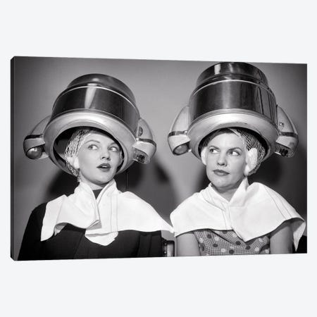 1950s Two Women Sitting Under Beauty Salon Hair Dryers Wearing Hairnets Towels Talking Gossip Canvas Print #VTG808} by Vintage Images Canvas Wall Art