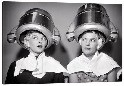 1950s Two Women Sitting Under Beauty Salon Hair Dryers Wearing Hairnets Towels Talking Gossip Canvas Art Print - Historical Fashion Art